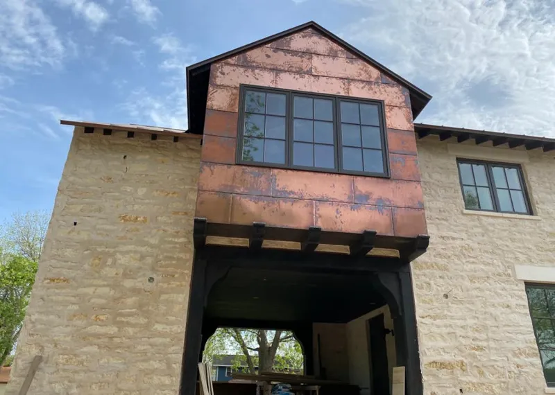 Copper metal panel facade on a stone building for Metal Roof Coating in Florida Ridge