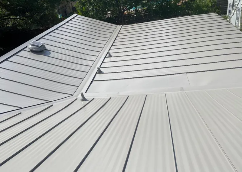 Solar attic fan installed on a metal roof for Roof Ventilation in Florida Ridge
